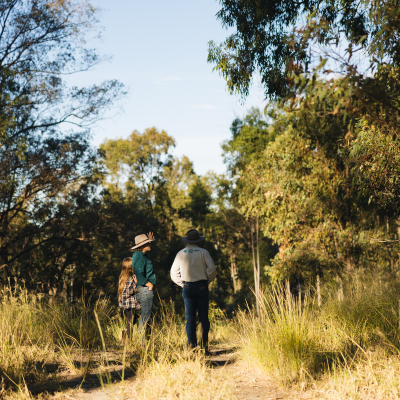 Two men walking on a path exploring the bushland