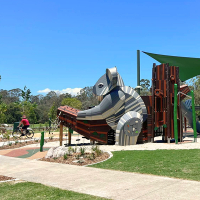 A new nature playground featuring very large koala as part of the playground.