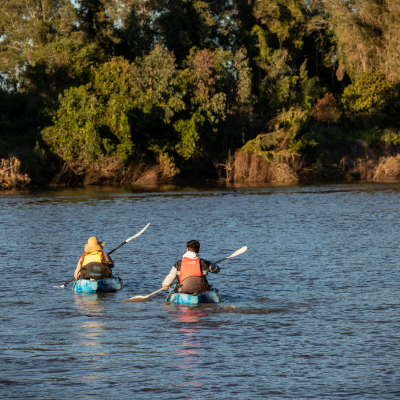 Two people in canoe's paddling in the Logan river