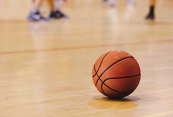 Basketball on court floor.