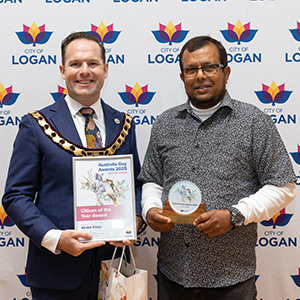 A photograph of Mayor Jon Raven and Citizen of the Year Abdul Khan.