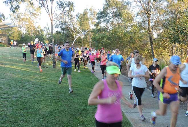 Runners running in park