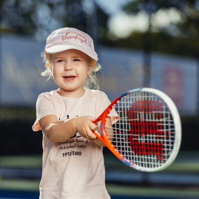 Child swinging a tennis racket