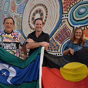 City of Logan Mayor Jon Raven (centre), Uncle Terry Stedman (left) and Aunty Sheryl Banks from the Logan District Aboriginal &amp; Torres Strait Islander Corporation for Elders invite the community to join in NAIDOC Day 2024 celebrations.