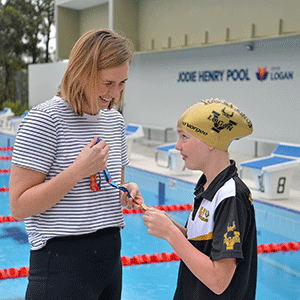Swimmer Jodie Henry, who grew up in Springwood, with Logan Vikings member Maddee Clarke at the reopening of Jodie Henry Pool at Underwood last year.