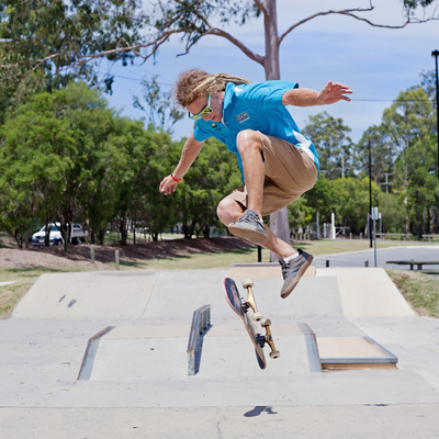 Young Man jumping on a skateboard.